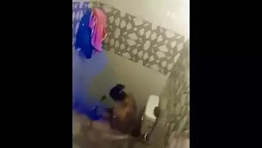 Perverted Indian cameraguy films his naked girlfriend pissing