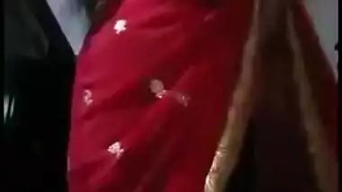Big juicy boobs and excited pussy are hidden under Desi girl's red dress