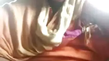 Attractive Indian teen demonstrates pussy while filming porn in garage
