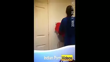 Hidden cam video of girl undressing