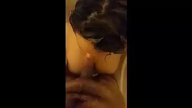 Cameraguy stands in bathtub and Indian girlfriend gives him blowjob