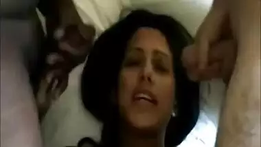 Hot brunette takes their cum on her face