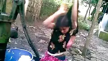 Sexy village girl having an open bath