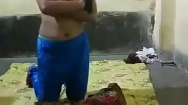 Half-naked young Indian woman allows man to come and touch XXX tits