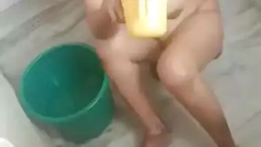 Indian aunty washes body focusing on boobs and muff in the bathroom
