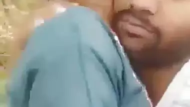 Indian outdoor sex of a guy sucking his GF’s tight boobs