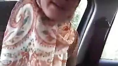 Arab hijab playing in car