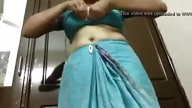 Indian aunty stripping her sari to show off