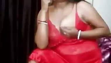 Hot Desi aunty seductively smokes being dressed in red XXX lingerie